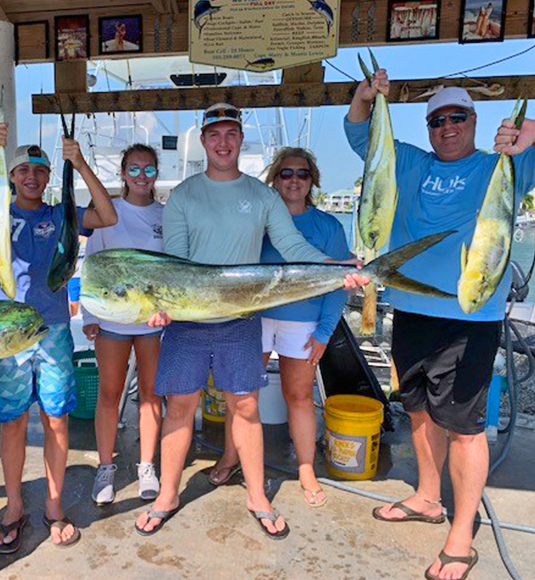 Jason Wyrick and family holding fish