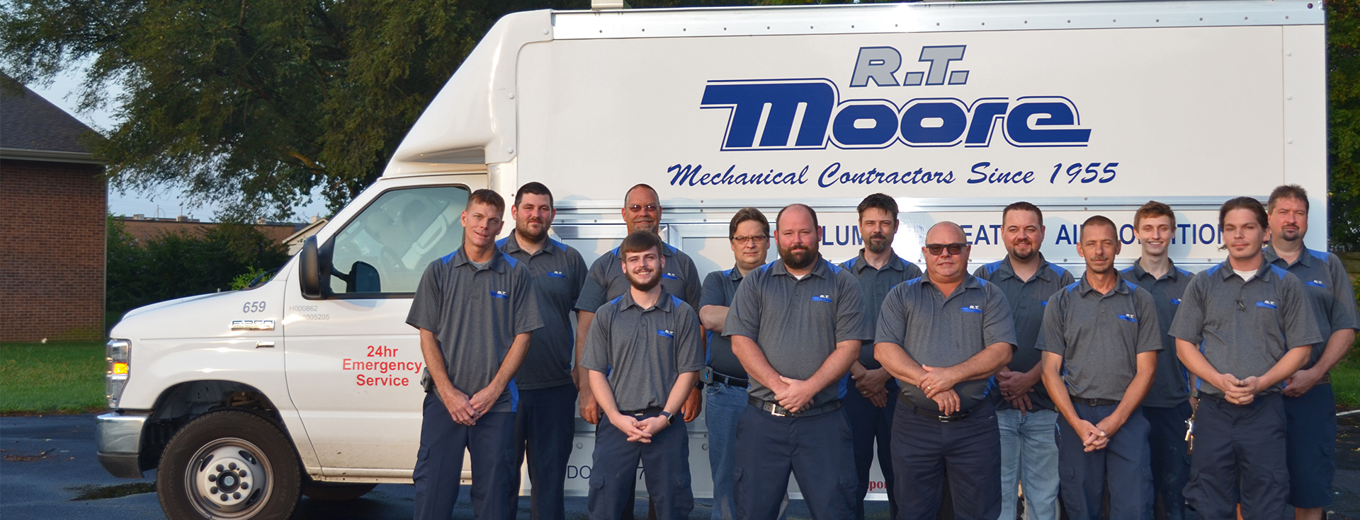 RT Moore Service Technician group photo in front of an RT Moore truck